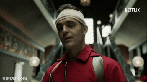 A Man Wearing A Headband With The Word Netflix Written On It GIF