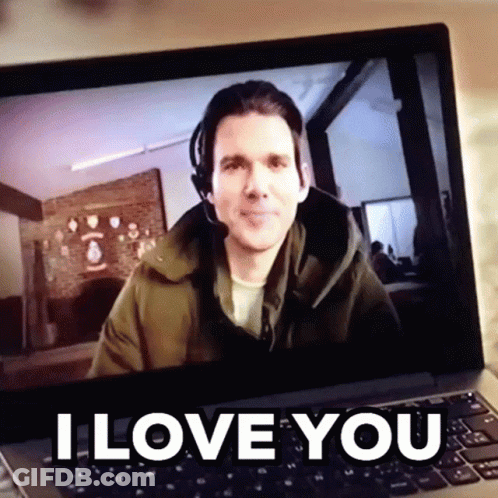 A Man Wearing A Headset Is On A Laptop Screen With The Words I Love You Above Him GIF