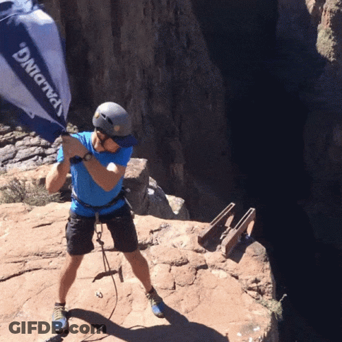 A Man Wearing A Helmet And A Blue Shirt That Says Spalding On It GIF