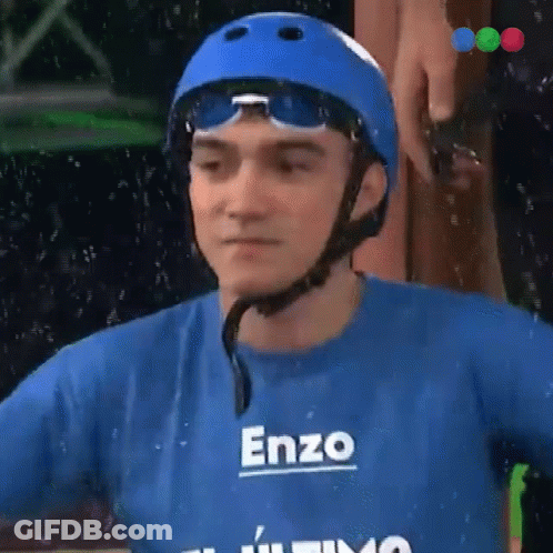 A Man Wearing A Helmet And A Blue Shirt With The Name Enzo On It GIF