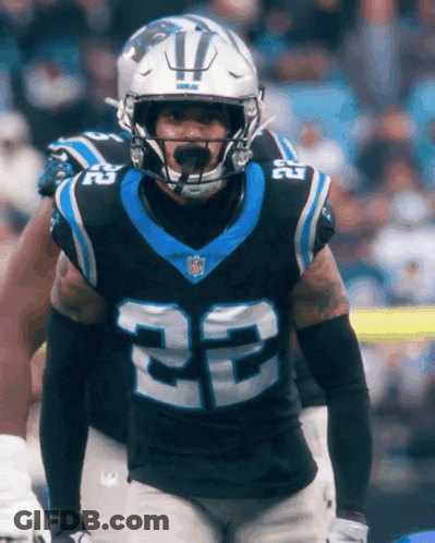 A Man Wearing A Helmet And A Jersey With The Number 22 On It GIF