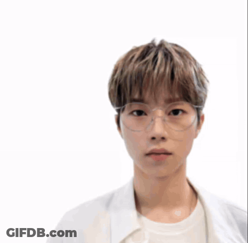 A Man Wearing A Helmet And Glasses Stands In Front Of A Battle Scene GIF