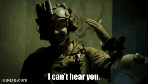 A Man Wearing A Helmet And Gloves Says I Can 'T Hear You GIF