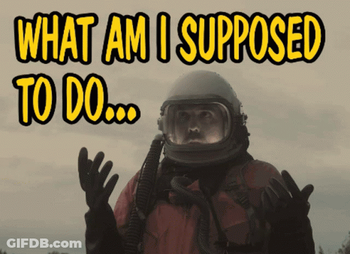 A Man Wearing A Helmet And Gloves Says What Am I Supposed To Do GIF