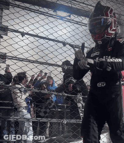 A Man Wearing A Helmet And Gloves With The Letters Gd On The Front GIF