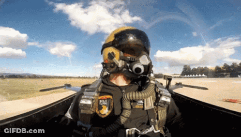 A Man Wearing A Helmet And Goggles Has A Patch On His Chest That Says ' Road ' On It GIF
