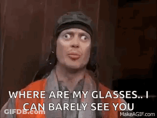A Man Wearing A Helmet And Goggles Is Saying `` Where Are My Glasses . I Can Barely See You '' . GIF