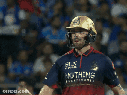 A Man Wearing A Helmet And Holding A Bat That Says Ton On It GIF