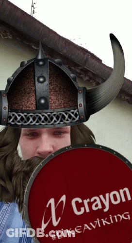 A Man Wearing A Helmet And Holding A Red Shield That Says Crayon GIF