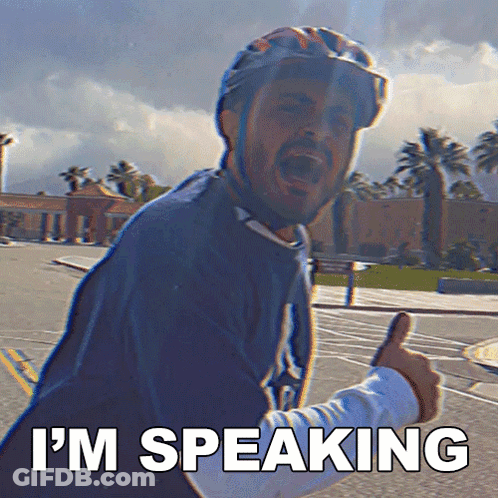 A Man Wearing A Helmet Giving A Thumbs Up With The Words I 'M Speaking Behind Him GIF