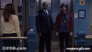 A Man Wearing A Helmet Is Giving A High Five GIF