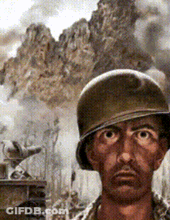 A Man Wearing A Helmet Is Looking At The Camera GIF