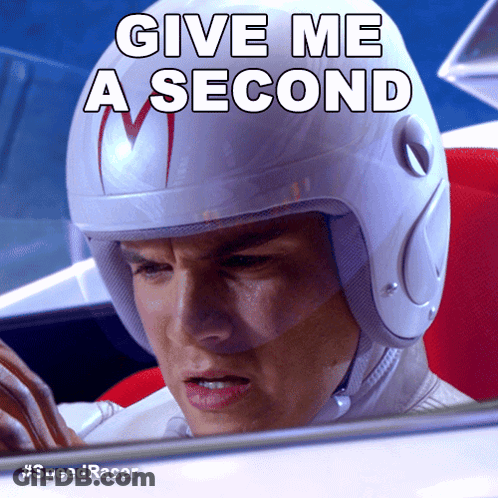 A Man Wearing A Helmet That Says Give Me A Second On It GIF