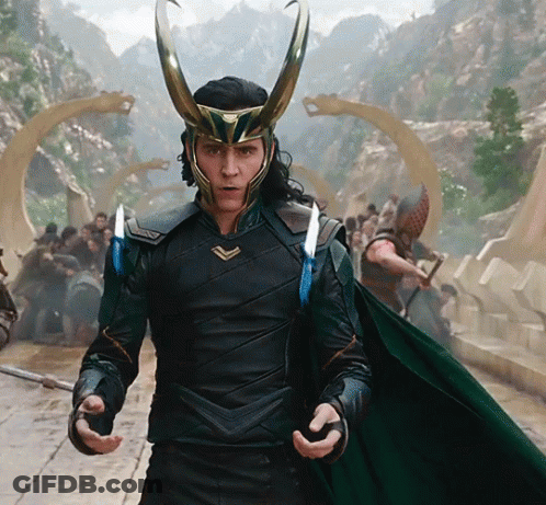 A Man Wearing A Helmet With Horns Is Standing In Front Of A Group Of People GIF