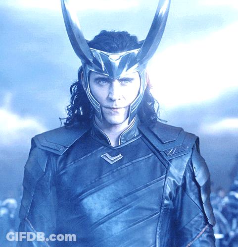 A Man Wearing A Helmet With Horns On His Head Looks At The Camera GIF