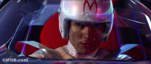 A Man Wearing A Helmet With The Letter M On It Is Sitting In A Car GIF