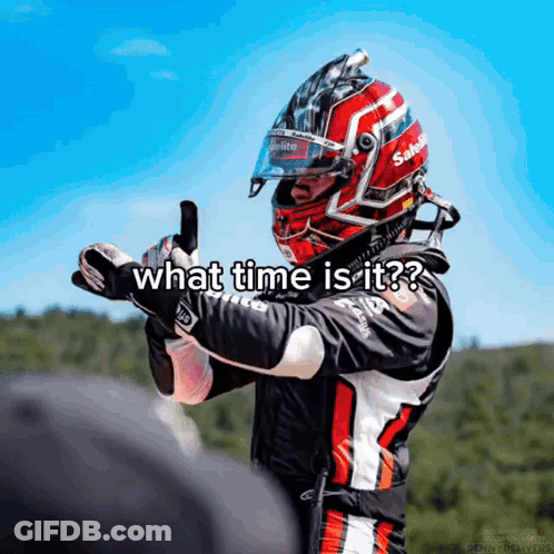 A Man Wearing A Helmet With The Words What Time Is It Written On It GIF