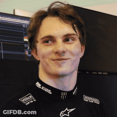 A Man Wearing A Hilton For The Stay Shirt GIF