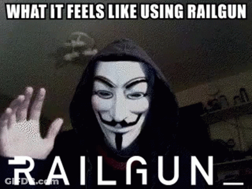 A Man Wearing A Hooded Jacket And A Anonymous Mask Is Making A Funny Meme . GIF