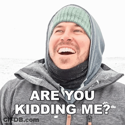 A Man Wearing A Hooded Jacket And A Beanie Smiles And Says " Are You Kidding Me " GIF