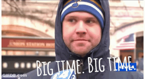 A Man Wearing A Hooded Jacket And A Hat Says Big Time Big Time GIF