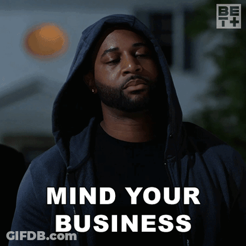 A Man Wearing A Hooded Jacket Says " Mind Your Business " GIF
