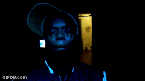 A Man Wearing A Hooded Jacket With A Nike Logo On It GIF