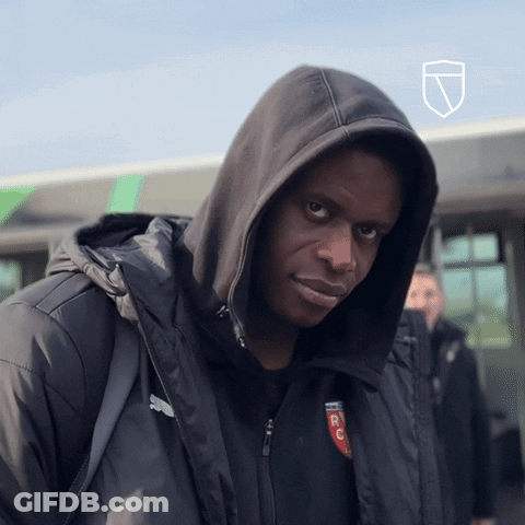 A Man Wearing A Hooded Jacket With A Rc Logo On It GIF