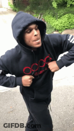 A Man Wearing A Hooded Sweatshirt That Says Oxg GIF