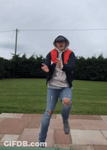 A Man Wearing A Hoodie And A Hat With The Word Coca Cola On It GIF
