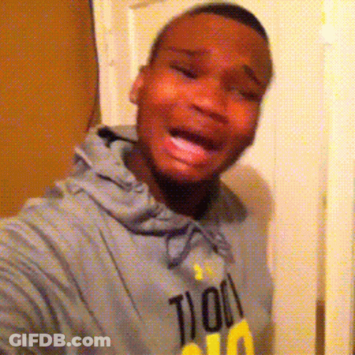 A Man Wearing A Hoodie That Says 100 On It Is Taking A Selfie GIF