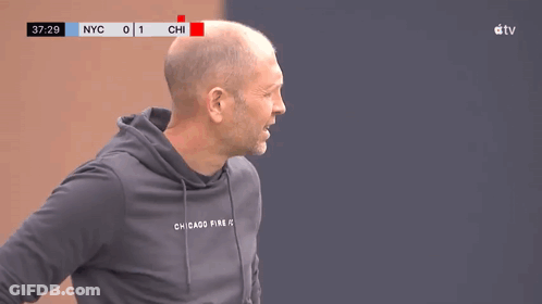 A Man Wearing A Hoodie That Says Chicago Fire On The Front GIF