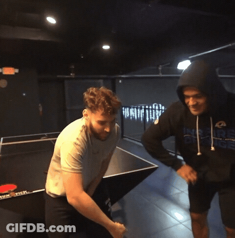 A Man Wearing A Hoodie That Says Rams Is Standing Next To Another Man GIF