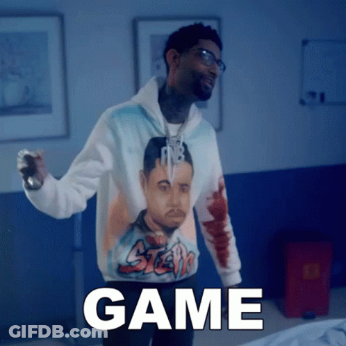 A Man Wearing A Hoodie With A Picture Of A Man And The Word Game GIF