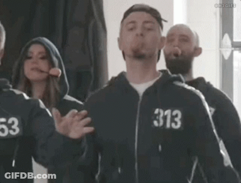 Man In Hoodie Blowing Cigarette With 313 Number GIF