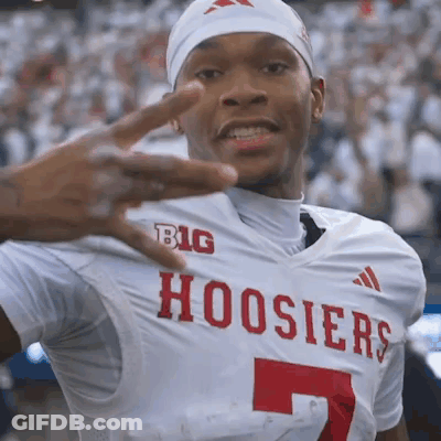 A Man Wearing A Hoosier Jersey Is Giving The Middle Finger GIF