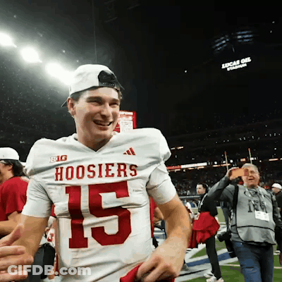 A Man Wearing A Hoosier Jersey With The Number 15 GIF