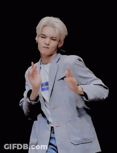 A Man Wearing A Jacket And A T-Shirt That Says ' Aderk ' On It GIF