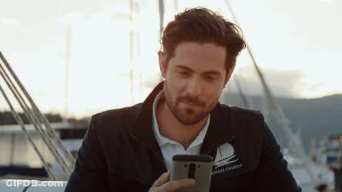 A Man Wearing A Jacket That Says Angel Chartered On It GIF