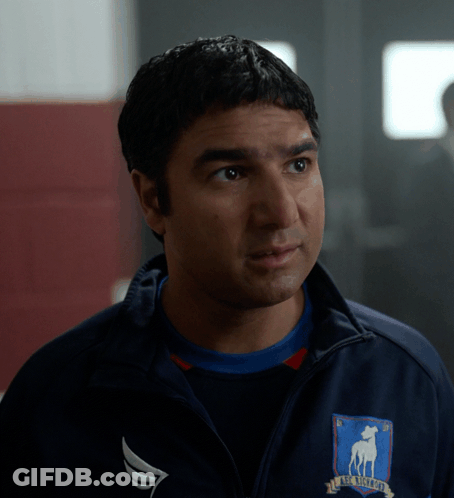 A Man Wearing A Jacket That Says Boston Bruins On It GIF