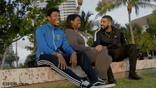 A Man Wearing A Jacket That Says ' Miami ' On It GIF