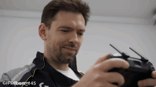 A Man Wearing A Jacket That Says Skip N Glide GIF