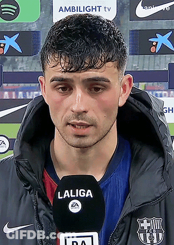 A Man Wearing A Jacket With A Laliga Logo On It GIF