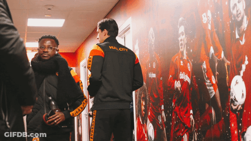 A Man Wearing A Jacket With Hull City On The Back GIF