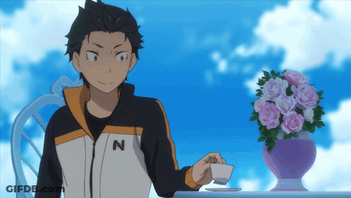 A Man Wearing A Jacket With The Letter N On It Sits At A Table GIF