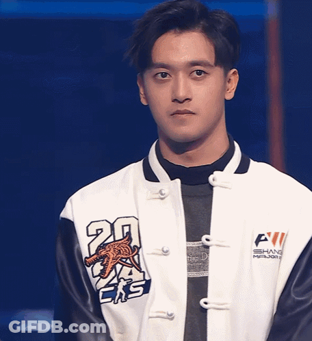 A Man Wearing A Jacket With The Number 20 On The Sleeve GIF