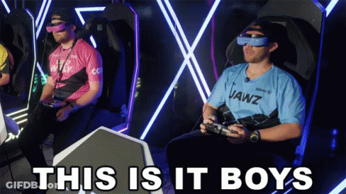 A Man Wearing A Jawz Shirt Sits In A Chair Playing A Video Game GIF