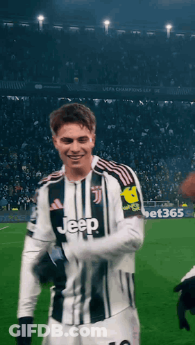 A Man Wearing A Jeep Jersey Stands On A Field GIF