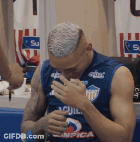A Man Wearing A Jersey That Says " Aguila " On It GIF