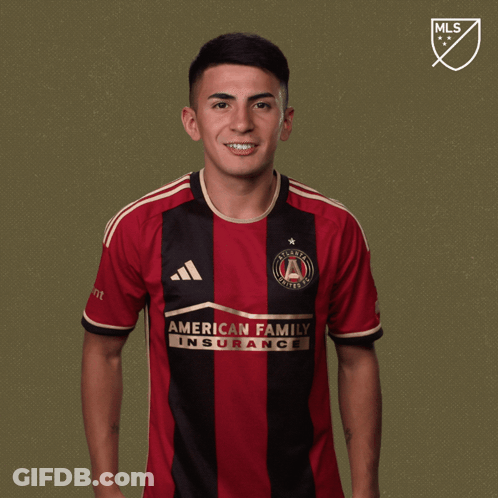 A Man Wearing A Jersey That Says " American Family Insurance " GIF